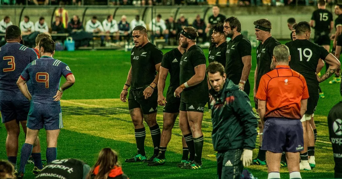 The All Blacks front row is getting ready to scrum