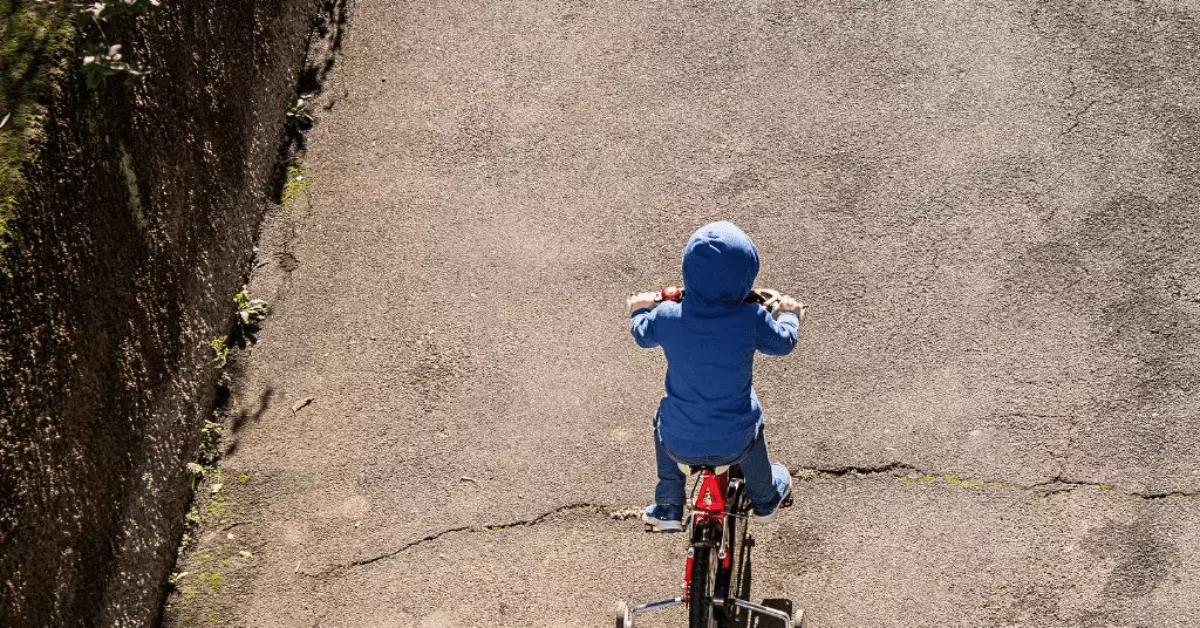 Young kid is cycling