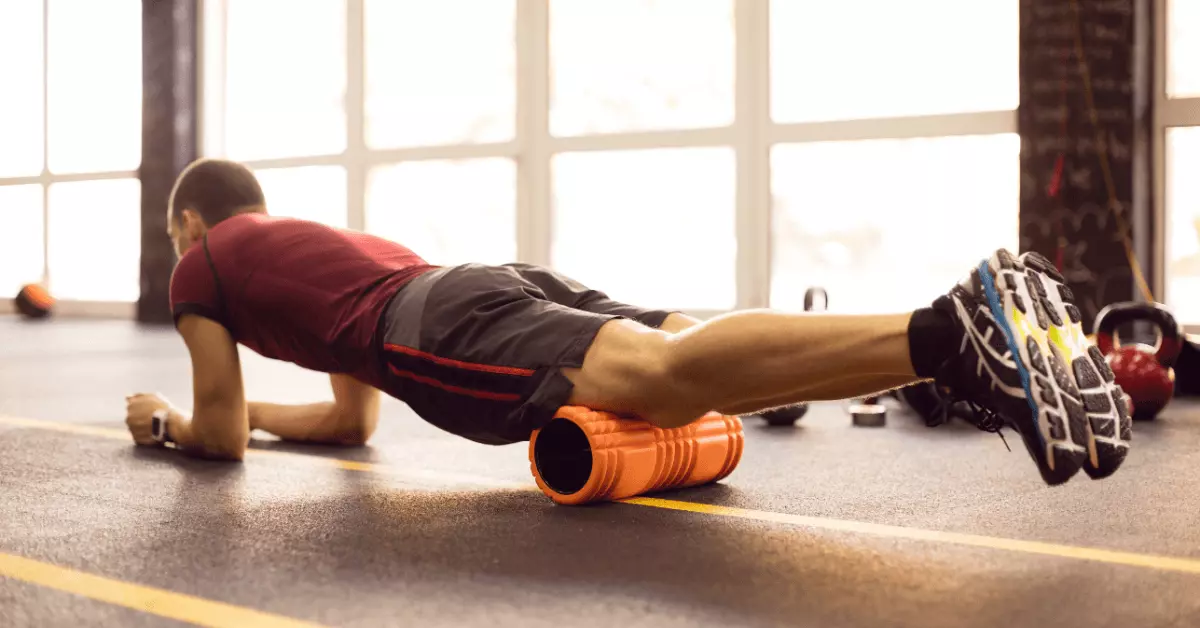 An athlete performing foam rolling excercises 