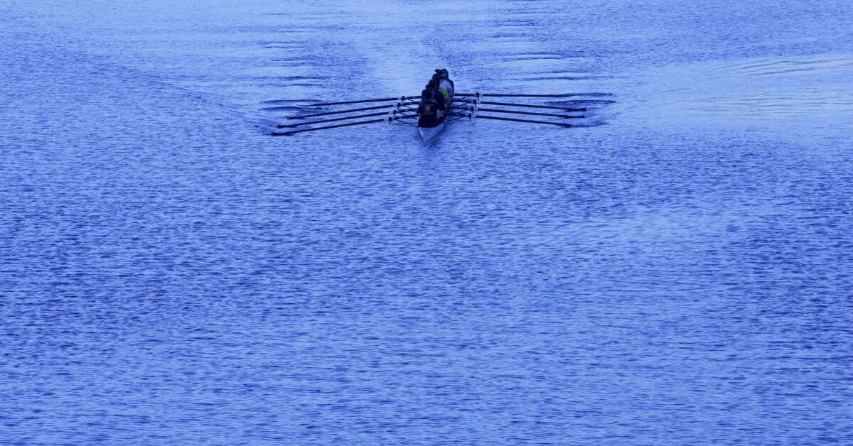 A rowing team practicing together