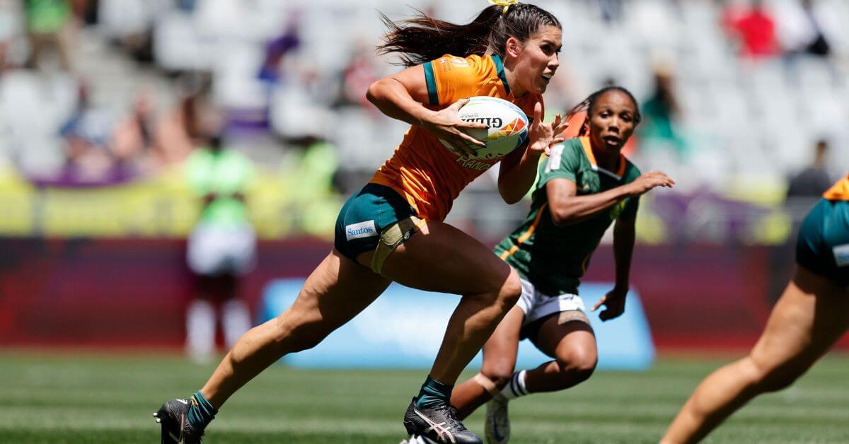 Charlotte Caslick carrying the ball for the Wallaroos