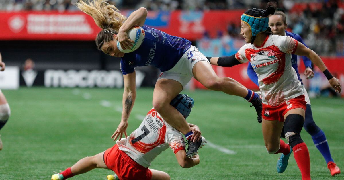 France's Chloe Pelle charges through the Japan defense on day one of the HSBC Canada Sevens at BC Place Stadium on 3 March, 2023 in Vancouver, Canada.
