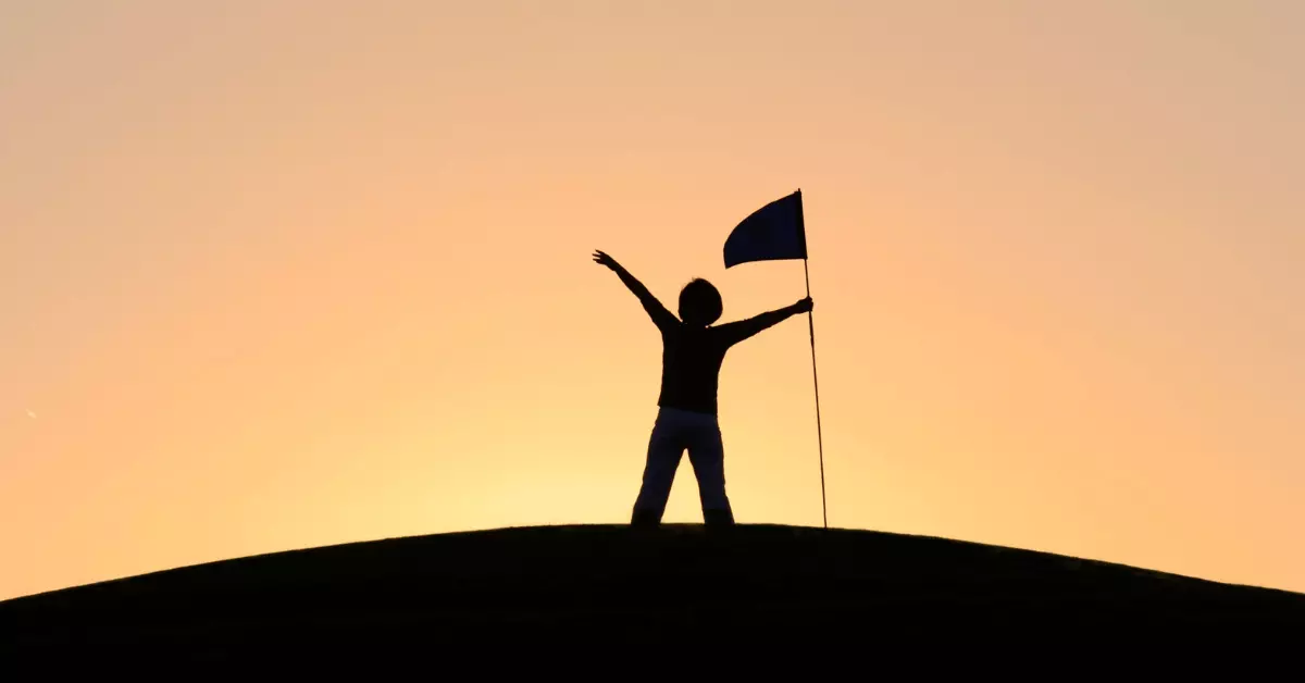 A person reaching the top of the hill