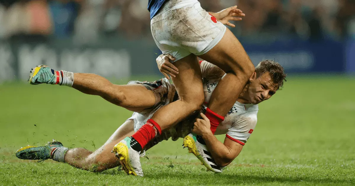 A rugby player tackles another player at the World Rugby Sevens Series