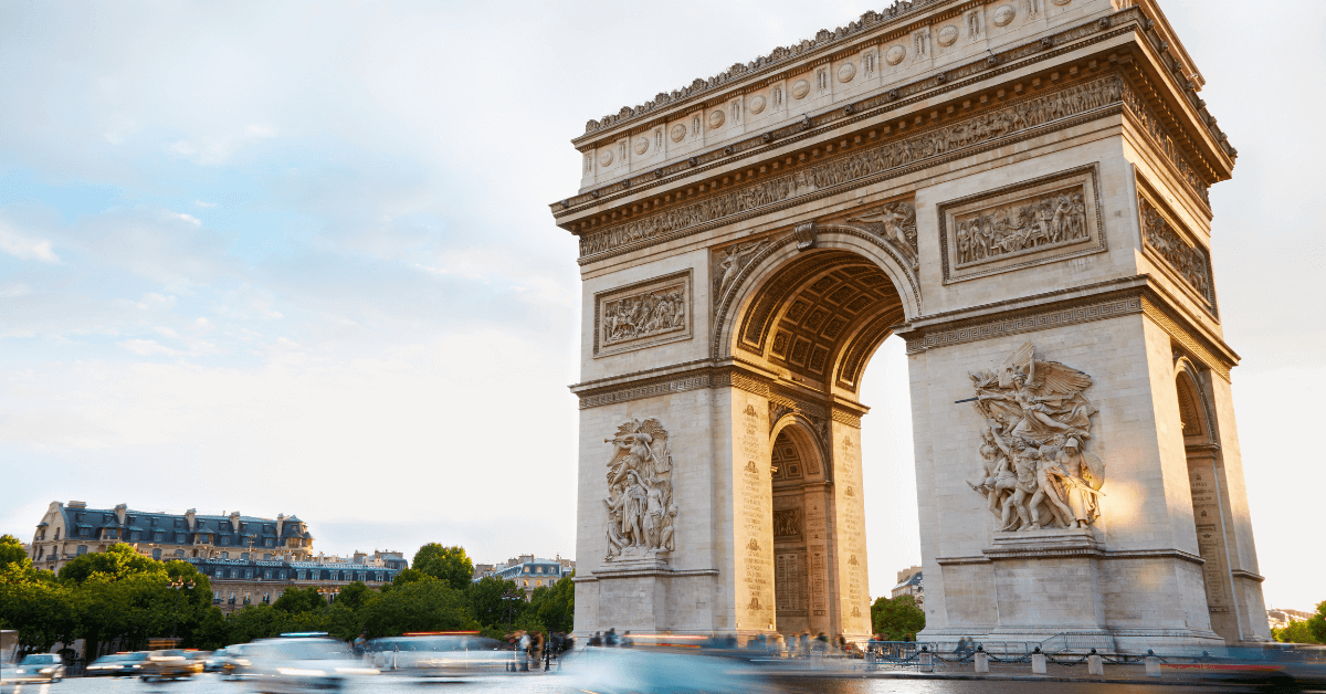 The image shows the Arc de Triomphe, a famous triumphal arch in Paris, France. It is one of the most iconic landmarks in the world and is a popular tourist destination. The arch was built in the early 19th century to commemorate the victories of Napoleon Bonaparte. It is located at the end of the Champs-Élysées, a famous avenue in Paris.