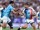 Antoine Dupont #11 of Team France is challenged by Bautista Basso #5 of Team Uruguay during the Men's Rugby Sevens Pool C Group match between France and Uruguay